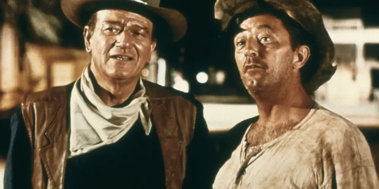 John Wayne und Robert Mitchum in "El Dorado" (1966), zwei raue Cowboys im staubigen Westen, bereit für jedes Abenteuer.