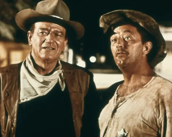 John Wayne und Robert Mitchum in "El Dorado" (1966), zwei raue Cowboys im staubigen Westen, bereit für jedes Abenteuer.