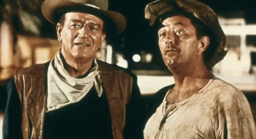 John Wayne und Robert Mitchum in "El Dorado" (1966), zwei raue Cowboys im staubigen Westen, bereit für jedes Abenteuer.