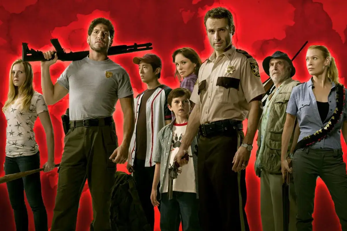 Die Hauptbesetzung von The Walking Dead steht vor einem roten Hintergrund. Sie sind bewaffnet und bereit, sich den Gefahren zu stellen.