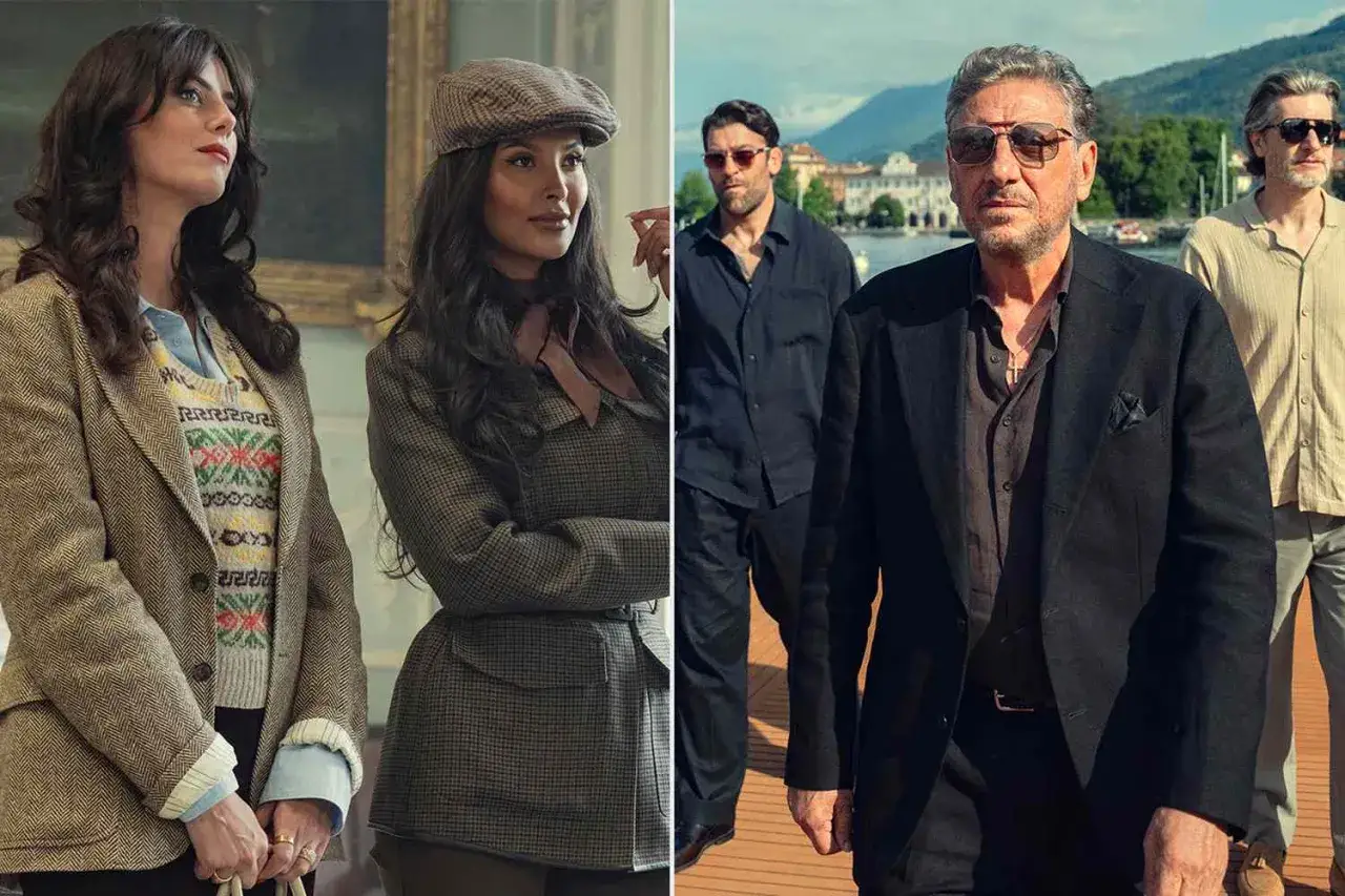 Die Besetzung von The Gentlemen: Zwei Frauen in Tweed-Jacken und eine Gruppe von Männern in dunklen Anzügen am Wasser.
